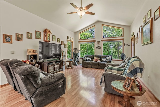 19243 Kiona Rd, Randle, WA 98377 - living room featuring light wood-type flooring, ceiling fan, lofted ceiling, and baseboards