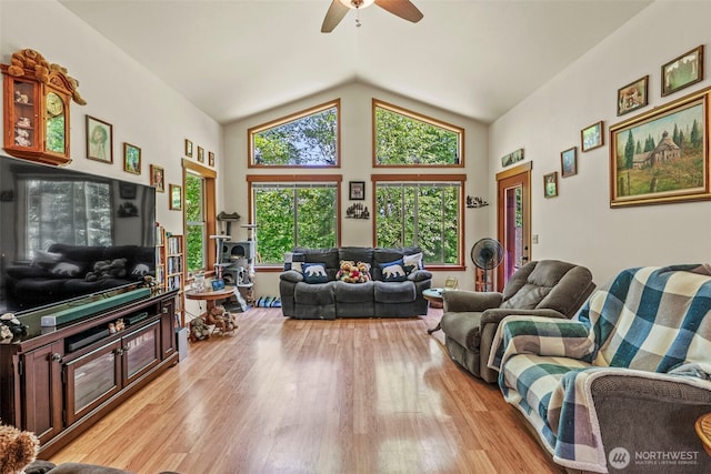 19243 Kiona Rd, Randle, WA 98377 - living room featuring wood finished floors, vaulted ceiling, and a ceiling fan