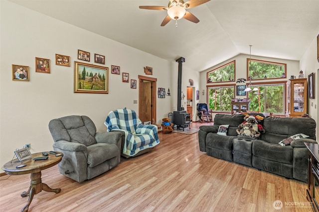 19243 Kiona Rd, Randle, WA 98377 - living room with a wood stove, a ceiling fan, light wood finished floors, and lofted ceiling