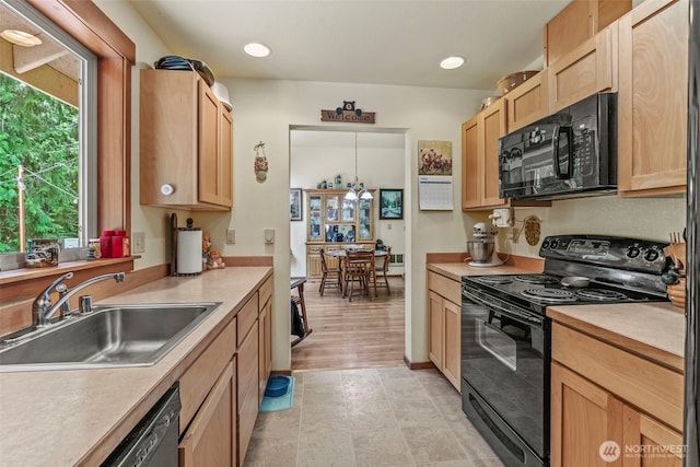 19243 Kiona Rd, Randle, WA 98377 - kitchen featuring black appliances, a sink, light brown cabinets, light countertops, and recessed lighting