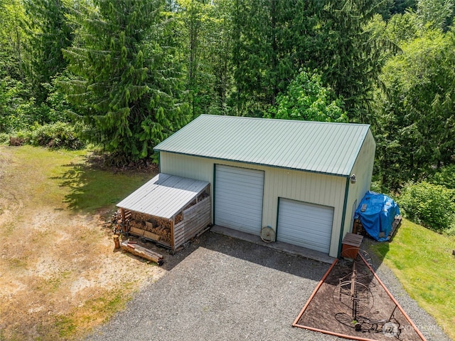 19243 Kiona Rd, Randle, WA 98377 - detached garage featuring a view of trees