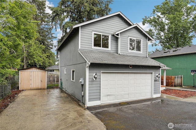 8411 68th Avenue Ct SW, Lakewood, WA 98499 - view of front of property featuring roof with shingles, asphalt driveway, and a garage