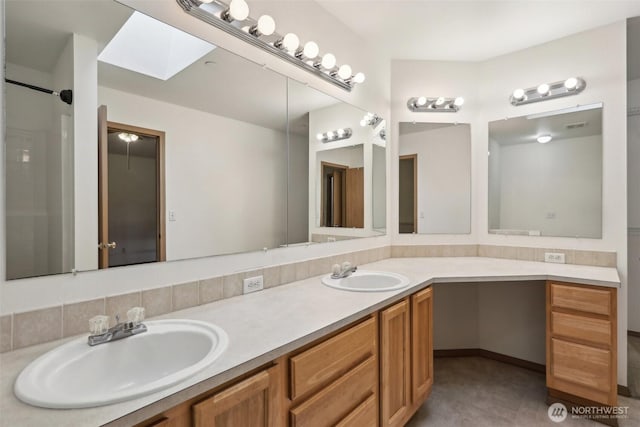 8411 68th Avenue Ct SW, Lakewood, WA 98499 - bathroom with double vanity and a skylight