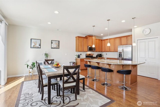 1903 98th Ave SE, Lake Stevens, WA 98258 - dining area featuring light wood-style floors, recessed lighting, and baseboards