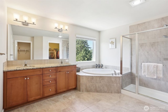 1903 98th Ave SE, Lake Stevens, WA 98258 - bathroom with tile patterned flooring, a shower stall, a garden tub, a walk in closet, and double vanity