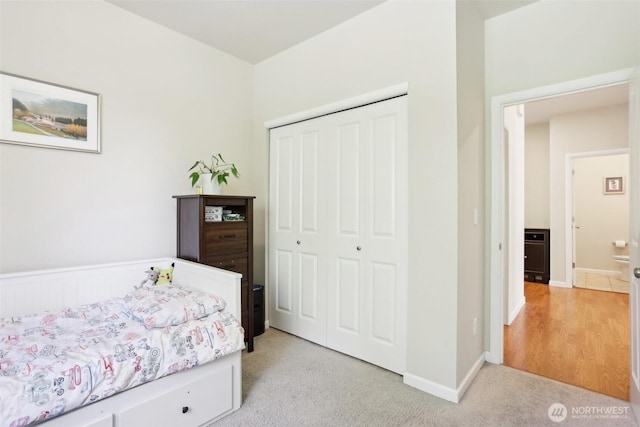 1903 98th Ave SE, Lake Stevens, WA 98258 - bedroom featuring a closet, light carpet, and baseboards