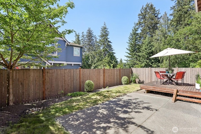 1903 98th Ave SE, Lake Stevens, WA 98258 - fenced backyard with a patio area, outdoor dining area, and a wooden deck