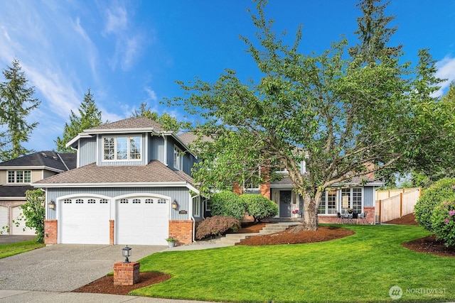 24228 SE 47th St, Sammamish, WA 98029 - view of front of property with driveway, an attached garage, brick siding, and a shingled roof