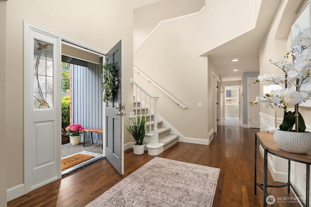 24228 SE 47th St, Sammamish, WA 98029 - foyer entrance featuring dark wood-style flooring, stairway, and baseboards