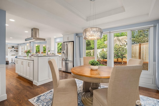 24228 SE 47th St, Sammamish, WA 98029 - dining space featuring plenty of natural light, a tray ceiling, dark wood-style floors, recessed lighting, and a chandelier