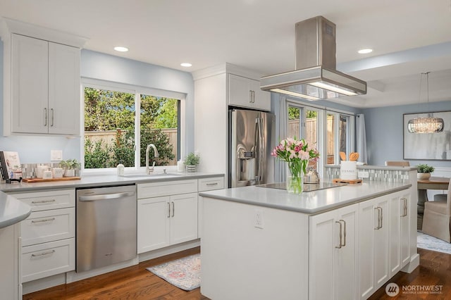 24228 SE 47th St, Sammamish, WA 98029 - kitchen with appliances with stainless steel finishes, a sink, island range hood, white cabinetry, and recessed lighting