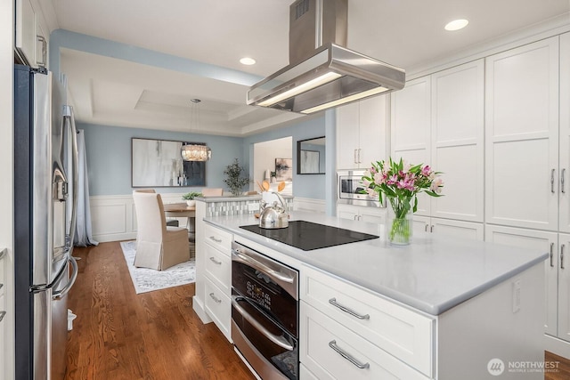 24228 SE 47th St, Sammamish, WA 98029 - kitchen with appliances with stainless steel finishes, island exhaust hood, dark wood-type flooring, light countertops, and white cabinets
