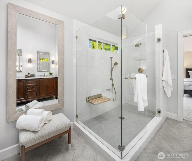 24228 SE 47th St, Sammamish, WA 98029 - bathroom with baseboards, a tile shower, vanity, and ensuite bathroom