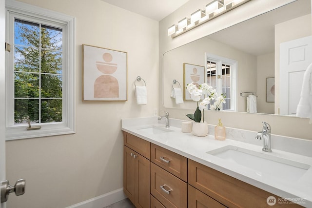 24228 SE 47th St, Sammamish, WA 98029 - bathroom with double vanity and baseboards