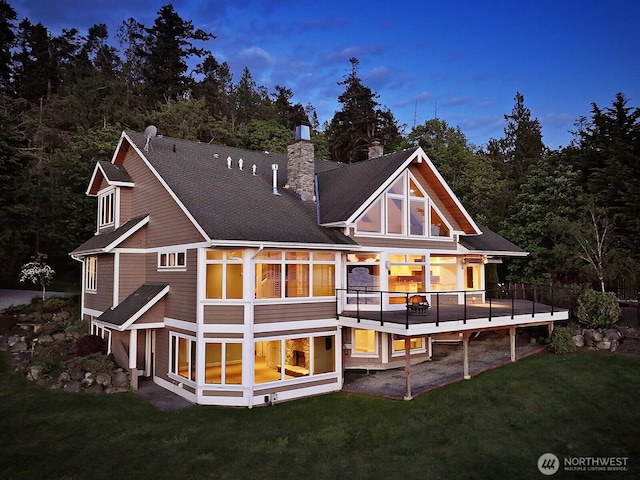 4486 E Harbor Rd, Freeland, WA 98249 - back of house with a chimney, a yard, and a wooden deck