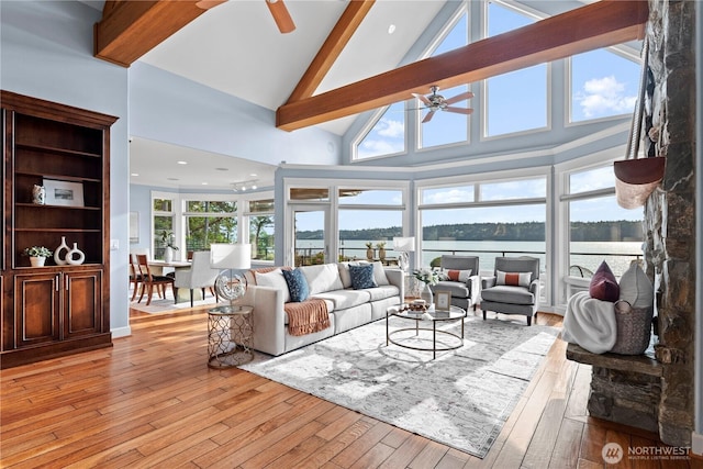 4486 E Harbor Rd, Freeland, WA 98249 - living area with a ceiling fan, beam ceiling, a water view, light wood finished floors, and high vaulted ceiling