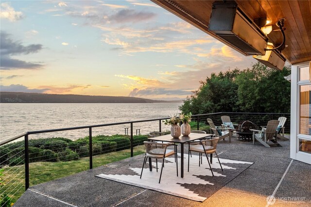 4486 E Harbor Rd, Freeland, WA 98249 - view of patio with a water view and an outdoor fire pit