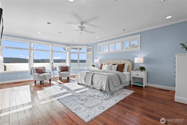 4486 E Harbor Rd, Freeland, WA 98249 - bedroom featuring ornamental molding, baseboards, hardwood / wood-style floors, a ceiling fan, and recessed lighting