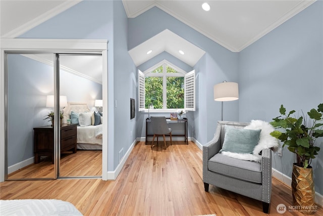 4486 E Harbor Rd, Freeland, WA 98249 - living area featuring vaulted ceiling, crown molding, wood finished floors, recessed lighting, and baseboards