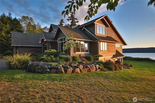 4486 E Harbor Rd, Freeland, WA 98249 - view of front of home with a front lawn and a water view