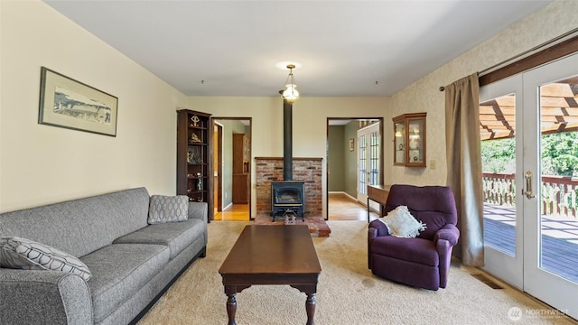 842 W Langdon Rd, Walla Walla, WA 99362 - living area with french doors, a wood stove, plenty of natural light, and light colored carpet
