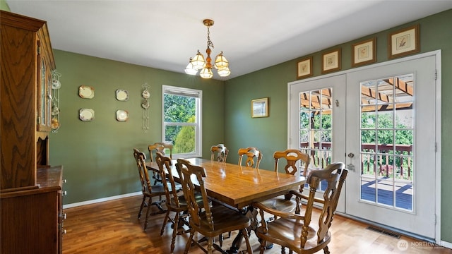 842 W Langdon Rd, Walla Walla, WA 99362 - dining space with wood finished floors, a chandelier, baseboards, and french doors