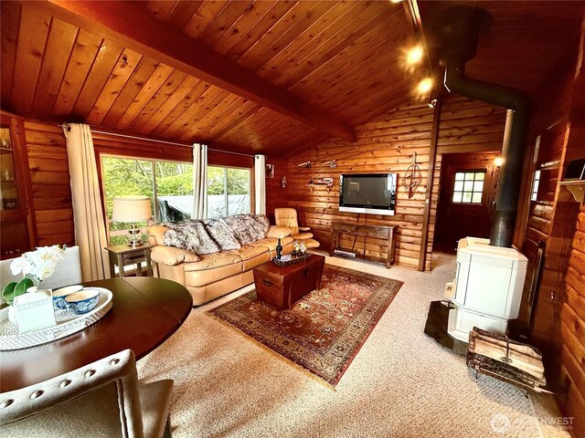 71 N Potlatch Dr N, Hoodsport, WA 98548 - carpeted living area featuring wooden walls, a wood stove, and wood ceiling