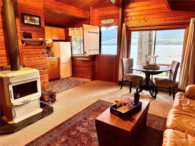 71 N Potlatch Dr N, Hoodsport, WA 98548 - living area with carpet flooring, wood ceiling, wooden walls, heating unit, and a water view