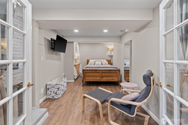 18568 Densmore Ave N, Shoreline, WA 98133 - bedroom featuring wood finished floors, french doors, and recessed lighting
