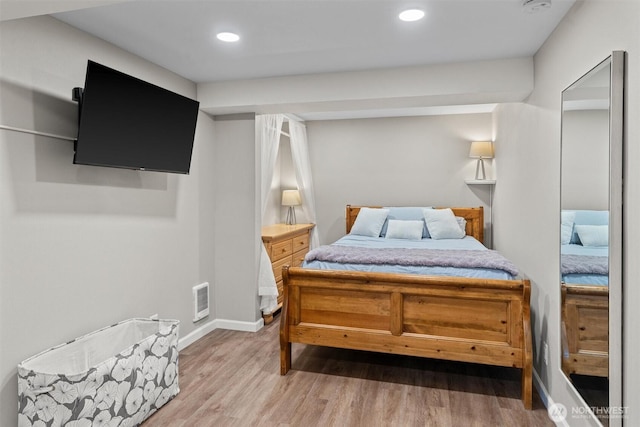 18568 Densmore Ave N, Shoreline, WA 98133 - bedroom with wood finished floors and recessed lighting