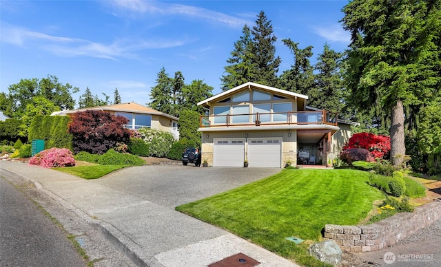 3026 E Alpine Dr, Bellingham, WA 98226 - view of front facade with a balcony, driveway, a front yard, a garage, and stone siding