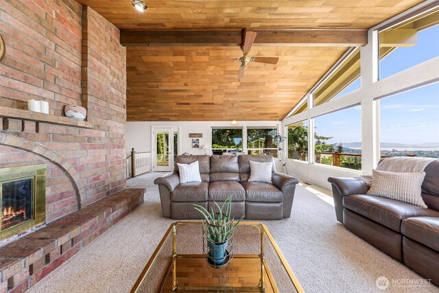 3026 E Alpine Dr, Bellingham, WA 98226 - carpeted living area with wooden ceiling, ceiling fan, and a fireplace