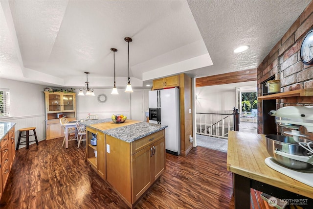3026 E Alpine Dr, Bellingham, WA 98226 - kitchen featuring white refrigerator with ice dispenser, a textured ceiling, dark wood-style floors, open shelves, and healthy amount of natural light