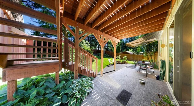 3026 E Alpine Dr, Bellingham, WA 98226 - fenced backyard featuring a patio, stairs, and outdoor dining area