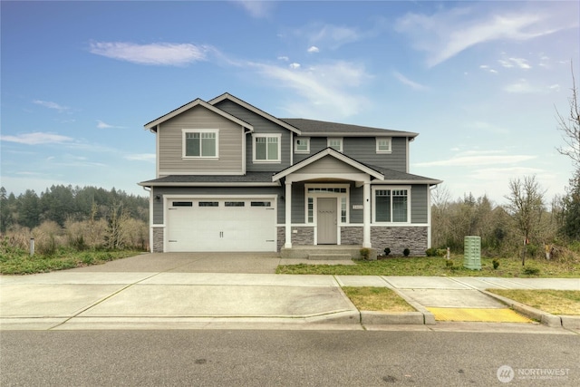 2403 79th Ave SE Unit 110, Tumwater, WA 98501 - craftsman house featuring stone siding, an attached garage, driveway, and a shingled roof