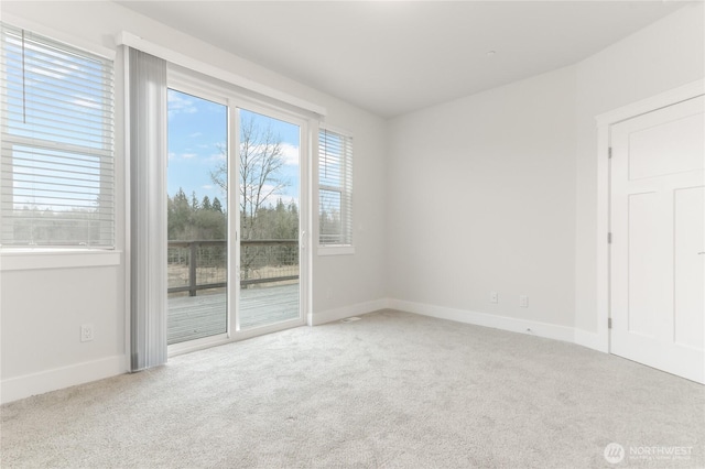 2403 79th Ave SE Unit 110, Tumwater, WA 98501 - carpeted spare room featuring baseboards