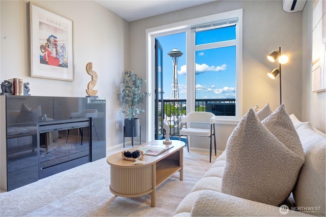 2721 1st Ave Unit Ph06, Seattle, WA 98121 - living room featuring carpet floors, a wall mounted AC, and baseboards
