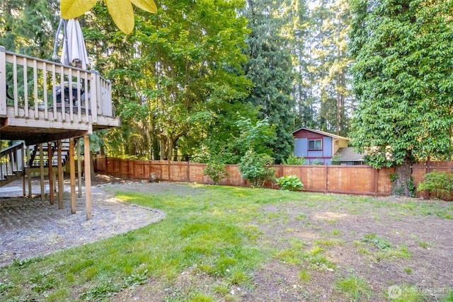 10908 151st St E, Puyallup, WA 98374 - fenced backyard with stairs and a wooden deck