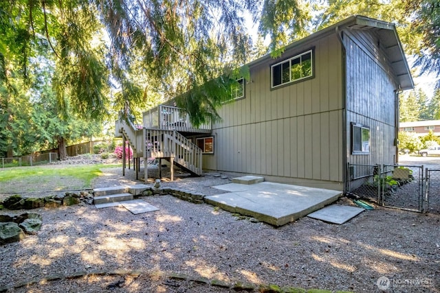 10908 151st St E, Puyallup, WA 98374 - rear view of property featuring a patio, stairs, a gate, and a deck