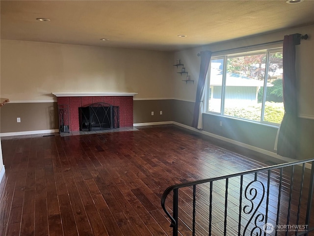 10908 151st St E, Puyallup, WA 98374 - unfurnished living room featuring hardwood / wood-style flooring, a brick fireplace, and recessed lighting