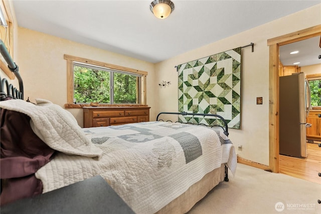 98 Homestead Rd, Winthrop, WA 98862 - bedroom with freestanding refrigerator, baseboards, and recessed lighting