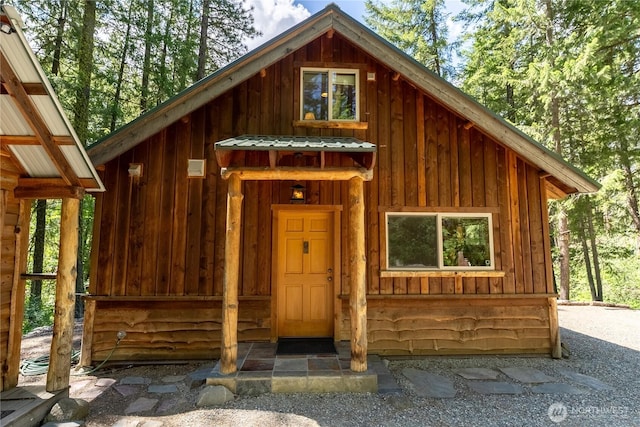 98 Homestead Rd, Winthrop, WA 98862 - view of front of home with board and batten siding and metal roof