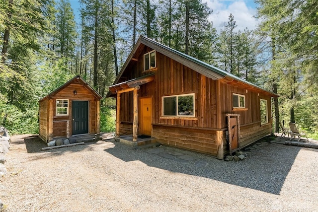 98 Homestead Rd, Winthrop, WA 98862 - view of front of house with board and batten siding and an outbuilding