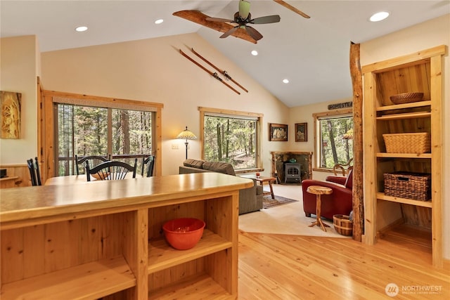 98 Homestead Rd, Winthrop, WA 98862 - kitchen with a wood stove, ceiling fan, wood finished floors, recessed lighting, and open floor plan