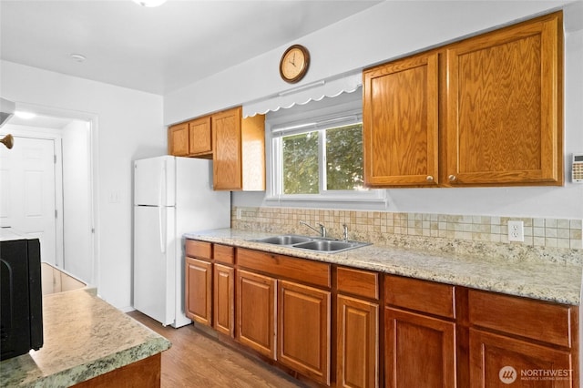 2526 S J St, Tacoma, WA 98405 - kitchen featuring freestanding refrigerator, a sink, light countertops, and brown cabinetry
