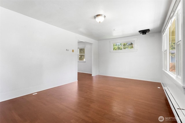 2526 S J St, Tacoma, WA 98405 - spare room with a baseboard radiator, wood finished floors, and baseboards