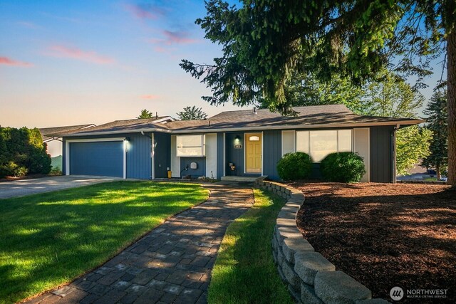 13632 SE Fairwood Blvd, Renton, WA 98058 - view of front facade featuring an attached garage, a lawn, and driveway