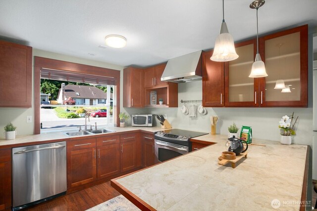 13632 SE Fairwood Blvd, Renton, WA 98058 - kitchen featuring appliances with stainless steel finishes, a sink, wall chimney exhaust hood, light countertops, and glass insert cabinets