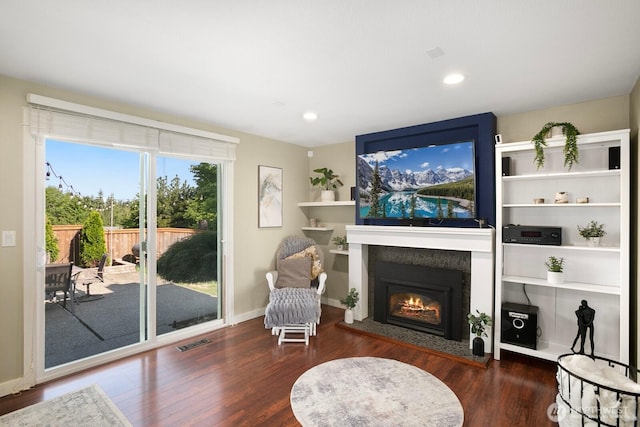 13632 SE Fairwood Blvd, Renton, WA 98058 - living area featuring wood finished floors, a glass covered fireplace, recessed lighting, and baseboards