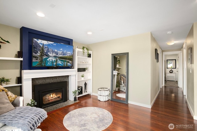 13632 SE Fairwood Blvd, Renton, WA 98058 - living area featuring wood finished floors, a glass covered fireplace, recessed lighting, and baseboards